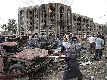 Iraqis gather at the site of a massive bomb attack in Baghdad, Iraq, Sunday, Oct. 25, 2009. Iraq police say that a pair of powerful explosions went off near the Ministry of Justice and the offices of a Kurdish political party during the morning rush hour as people headed to work. (AP Photo/Karim Kadim)