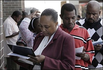 In this Sept. 25, 2009 photo, Khaliha Adger, from left, Gregory King, and Fred Jenkins fill out applications for positions at a new bar and restaurant in Detroit. he Labor Department said Thursday, Oct. 1, 2009, first-time claims for jobless benefits rose more than expected last week, a sign employers are reluctant to hire and the job market remains weak.(AP Photo/Paul Sancya )