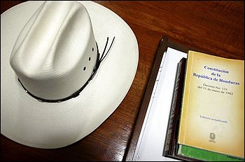 A hat of Honduras' ousted President Manuel Zelaya and the Honduran constitution sit on a desk at Brazilian embassy in Tegucigalpa, Wednesday, Oct. 28, 2009.(AP Photo/Esteban Felix)